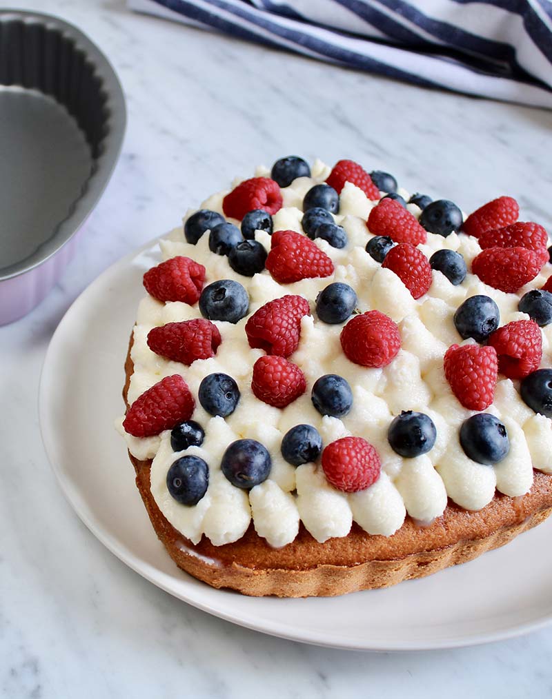 Paradise cake with cream and berries