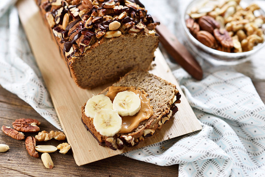 Triple nut banana bread drizzled with melted chocolate